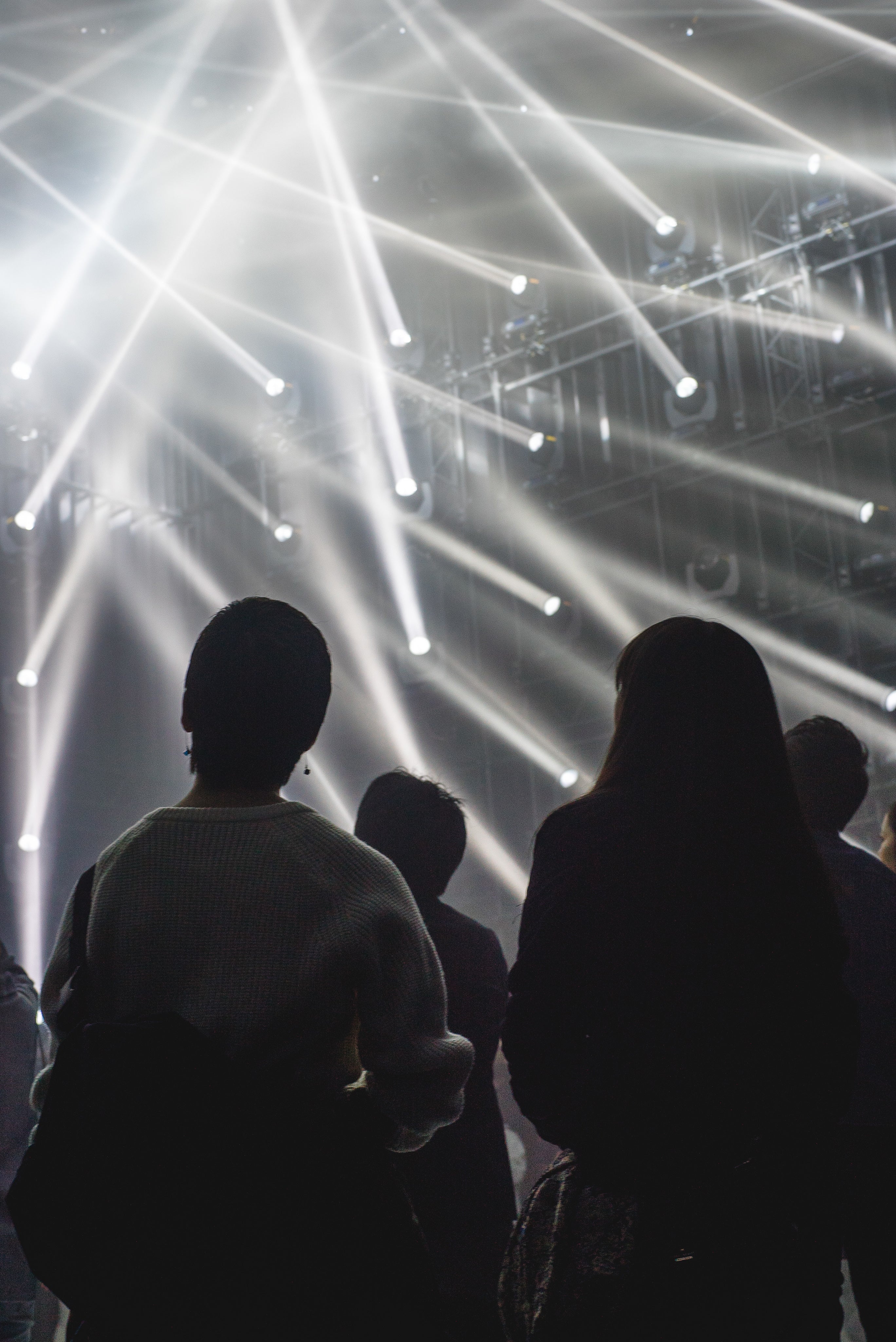people-looking-at-light-beams-from-the-walls.jpg